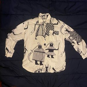 Vintage 90’s woman’s Ignote brand cotton bottom down shirt. Size M